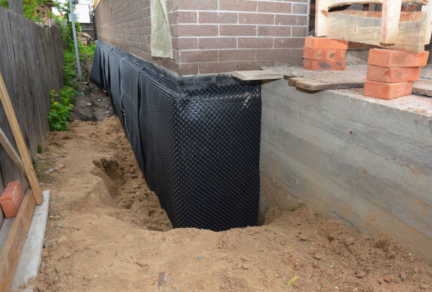 Happy homeowners after waterproofing job in Eagleville